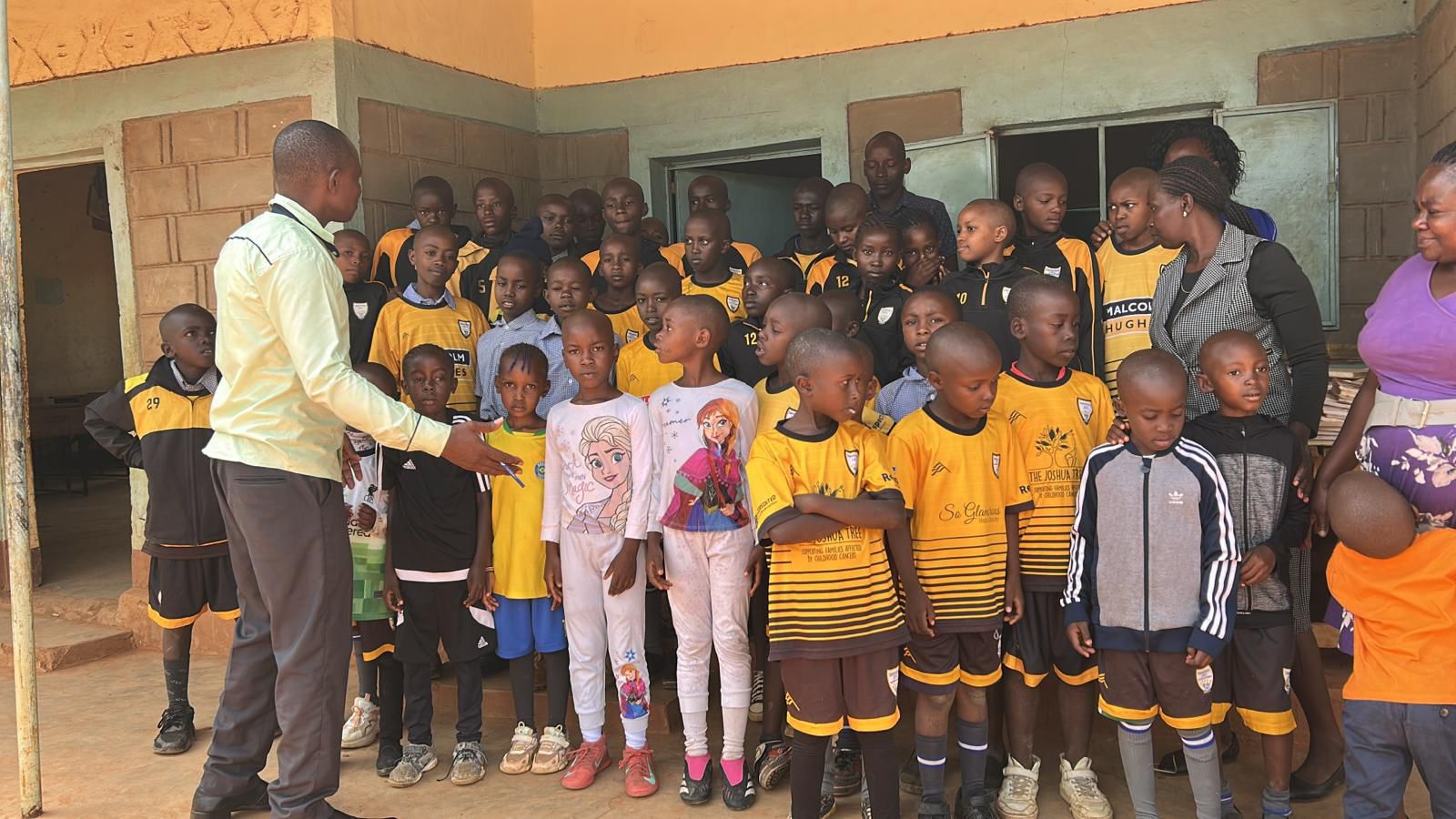 Malcolm Hughes Sponsored football team donate kit to primary school in Kenya